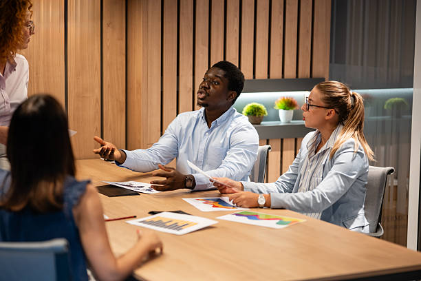 istock Diverse business team discussing data charts in modern office meeting 2246248944