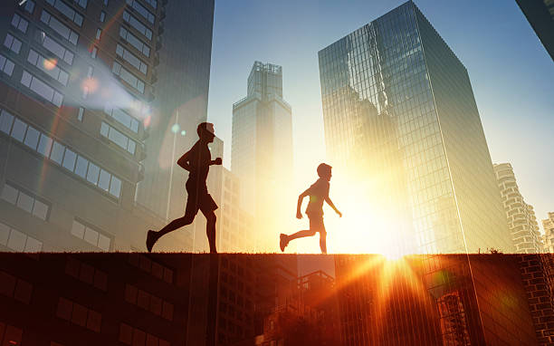 istock Father and son running at sunset against a city background. 2246249465