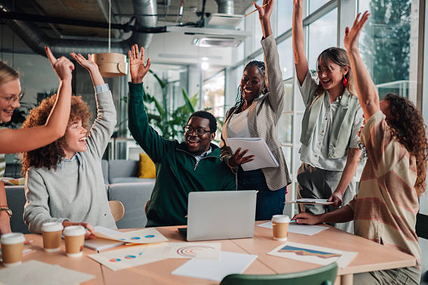 istock Diverse business team showing success in modern office 2246251294