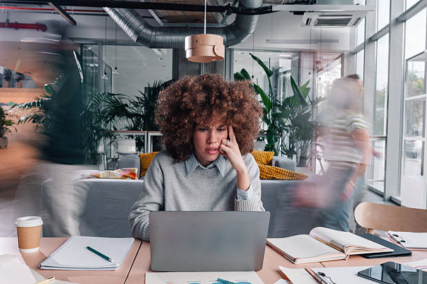 istock Woman experiencing stress and burnout in busy office 2246252959