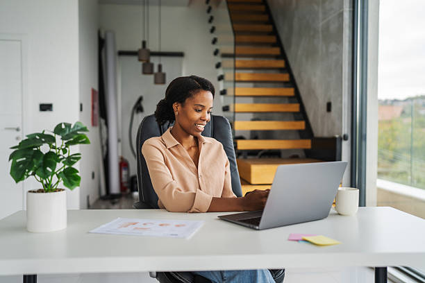 istock Black woman happily interacting on laptop during video call 2246253622