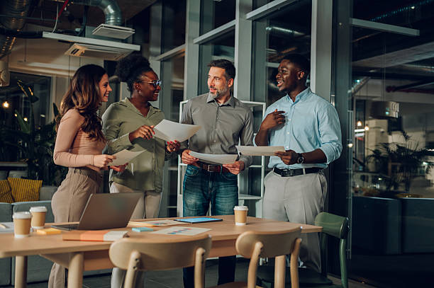 istock Diverse business team collaborating during late night work meeting 2246253912