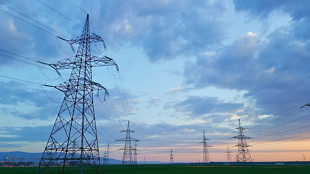 istock Power Lines and Pylons Silhouetted at Dusk 2246253923