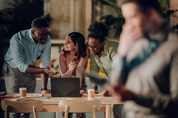 istock Diverse business team collaborating during late office meeting 2246253992