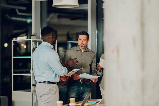 istock Diverse business team discussing project in modern office 2246254385