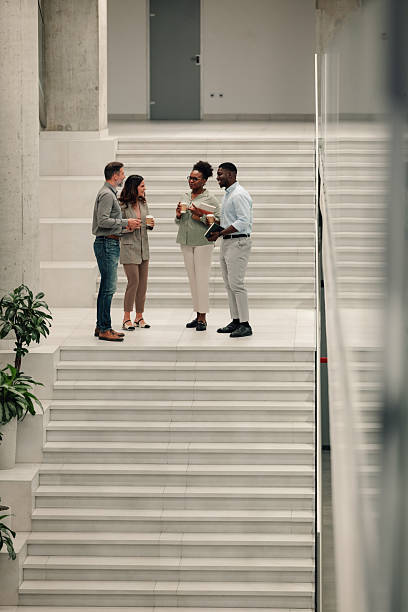 istock Diverse business colleagues having informal conversation during coffee break 2246255888