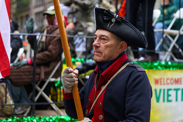 A historical reenactor dressed as a soldier from the Revolutionary War marches during the Veterans Day Parade on Fifth Avenue in New York on Nov. 11, 2025.