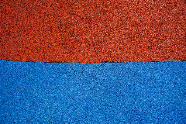 istock Vibrant red and blue rubber surface for sports activities 2246256497