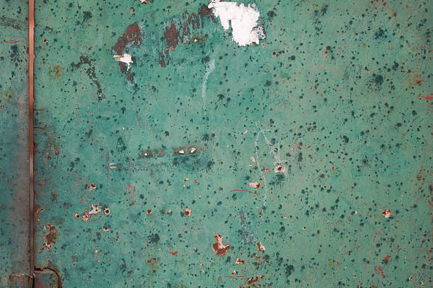 istock Green textured surface with peeling paint showing aged appearance 2246256652
