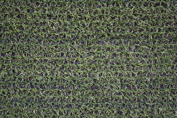 istock Close-up view of artificial green grass texture for landscaping 2246256656