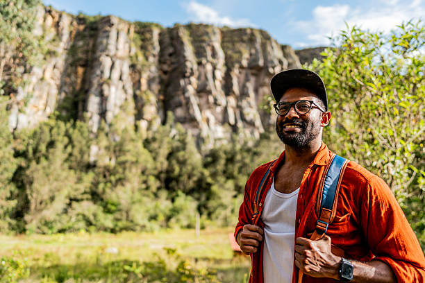 istock Happy mid adult man during hiking on forest 2246257648