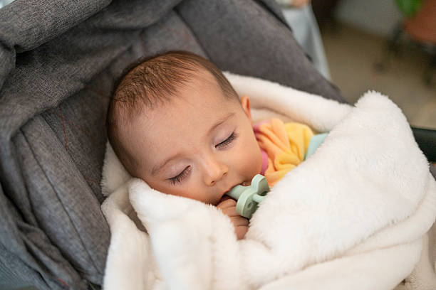 istock baby taking a nap comfortably wrapped up 2246259724