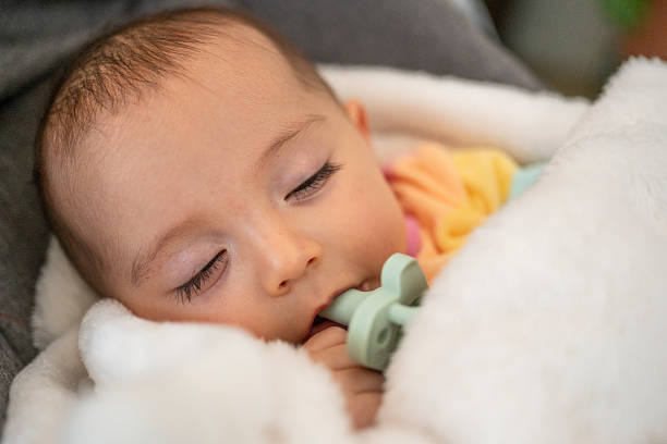 istock baby taking a nap comfortably wrapped up 2246259734