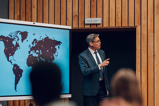 istock Businessman giving presentation about global network and worldwide strategy 2246260384