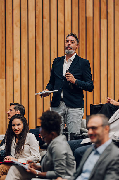 istock Speaker presenting to an audience at a business conference 2246260397