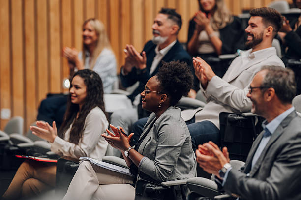 istock Diverse business people clapping at conference presentation 2246260407
