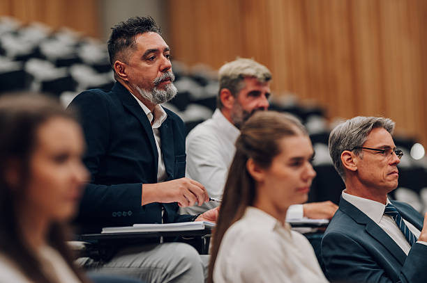 istock Professionals attending a business conference or educational seminar 2246260424
