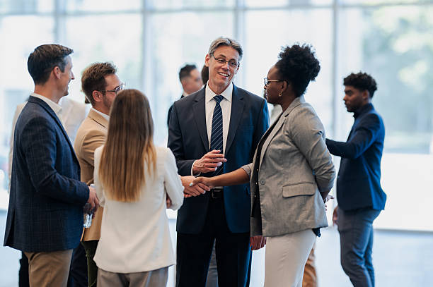 istock Business people handshaking at a professional corporate event 2246260432