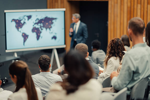 istock Business speaker presenting world map data at corporate conference 2246260501
