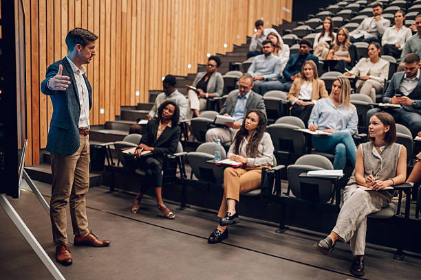 istock Speaker presenting during business conference to diverse audience 2246260582