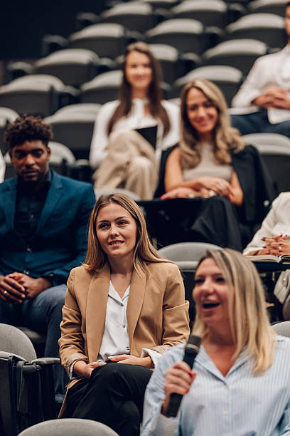 istock Diverse audience attentively listening during a business conference 2246260590