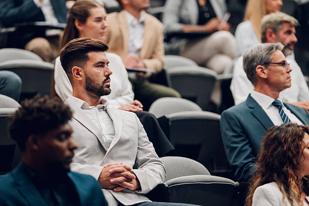 istock People attending business conference having group discussion 2246260610