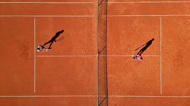 istock Two Tennis Players Practicing on Clay Court 2246260698
