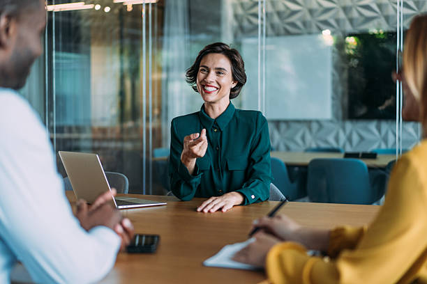 istock Group of business persons talking in the office. 2246260774