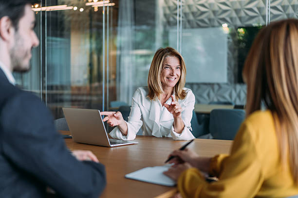 istock Group of business persons talking in the office. 2246260804