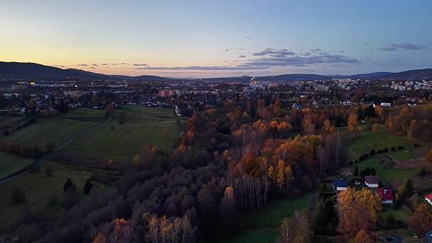 istock calm evening scenery with lights, serene twilight area featuring illuminated roofs and distant fields 2246260937