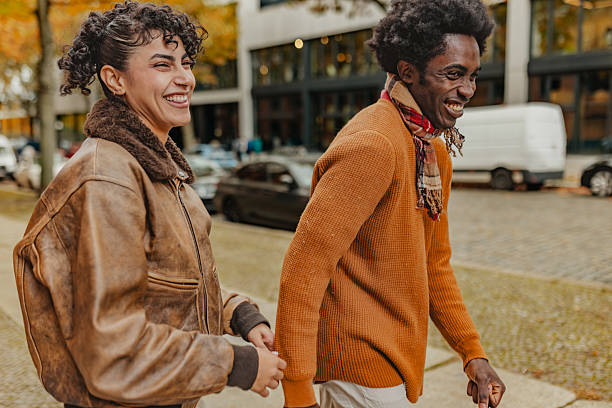 istock Young adults enjoying a joyful walk in Berlin's vibrant streets during a sunny day 2246262979