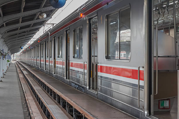 Jakarta, Indonesia - November 11, 2025 : The commuter line electric train on the Jakarta Kota station platform