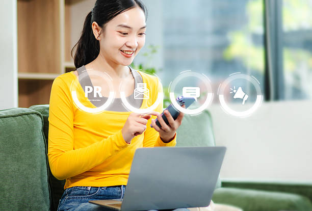 istock PR, Public relations concept. Asian woman hands using laptop and tablet with public relations icon for communication advertising marketing strategy. with Ads and sales 2246268020