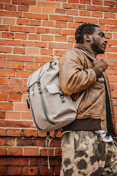 istock Young man enjoying a stroll in Berlin's vibrant streets with a stylish backpack 2246269263