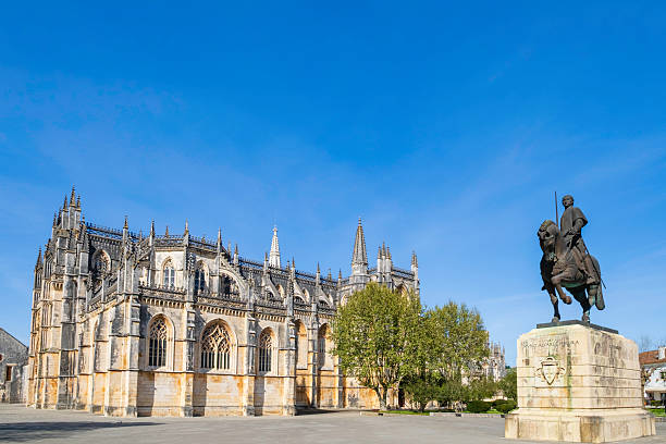 Monastery of Batalha, a Dominican convent built in Gothic style with parts in Manueline style, completed in 1517; it is a UNESCO Heritage Site. The equestrian monument is an artwork by sculptor Leopoldo de Almeida dated 1968, that depicts Nuno Álvares Pereira, a soldier and strategist of the Battle of Aljubarrota, and also a a simple brother in the Carmelite community,  canonized by Pope Benedict XVI in April 2009