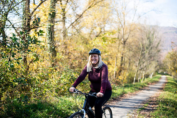 istock Senior Woman Riding Bicycle 2246288128