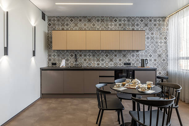 istock Cozy Modern Kitchen with Patterned Tiles and Black Furniture 2246288171