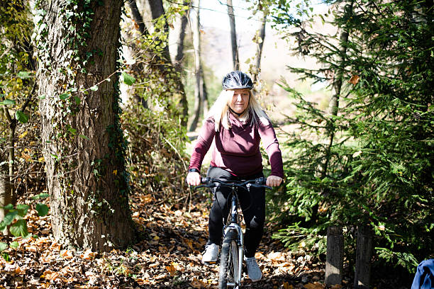 istock Senior Woman Riding Bicycle 2246288640