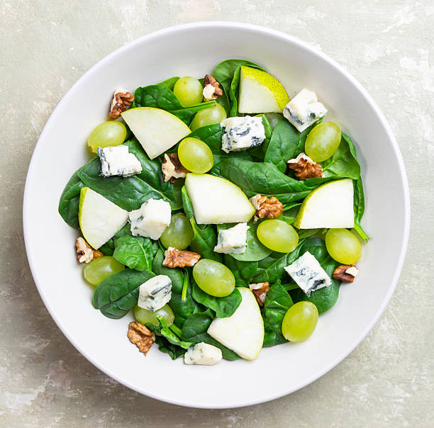 istock Salad with spinach, blue cheese, pear, grapes, and nuts. Healthy eating. Vegetarian. 2246288736