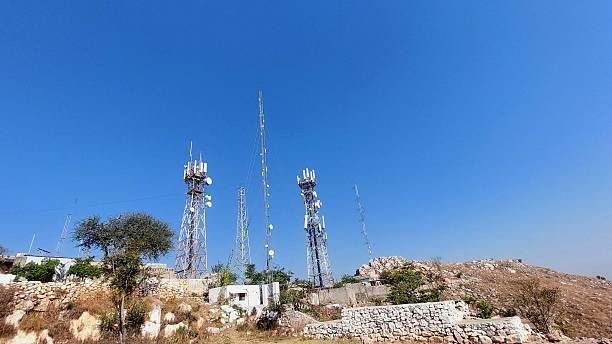 istock Communication Towers Cluster On Arid Rocky Hill 2246293306