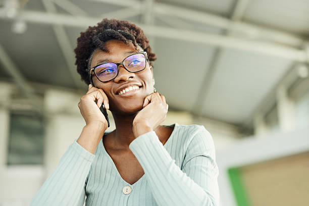istock Happy black woman talking on mobile phone. 2246293454