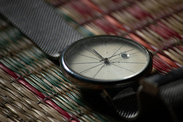 A macro of a retro-style watch with a shallow depth of field. Concept of time, memories, or vintage accessories.