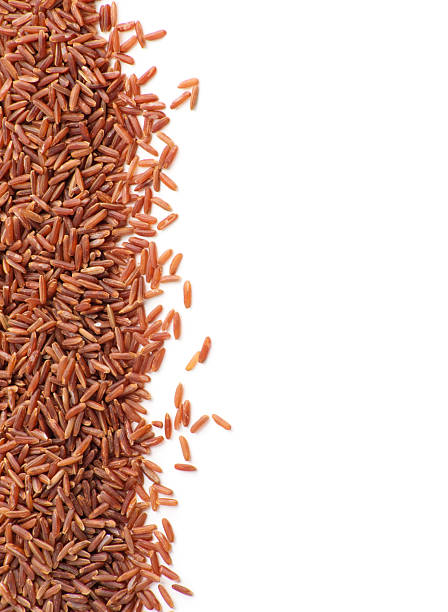 istock Wild red rice pile isolated on white background 2246294762