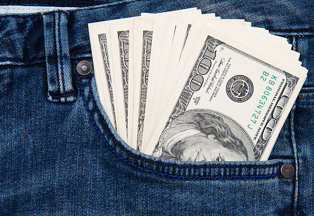 istock American dollar bills in jeans pocket background 2246295119