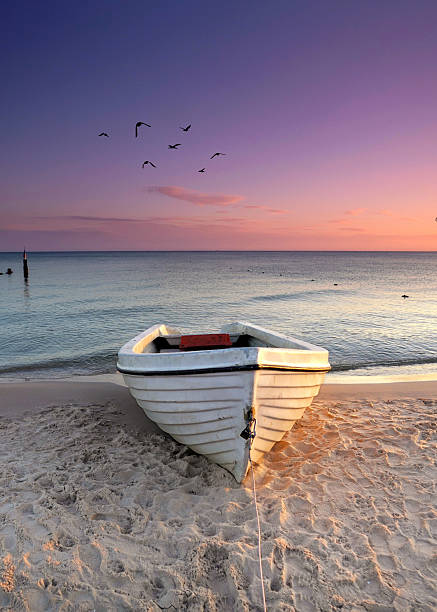 istock fishing boat on the beach in sunrise light 2246296147
