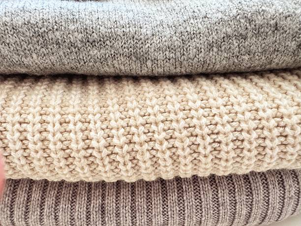 istock Autumn knitwear, stack of knitted folded clothing. 2246298277