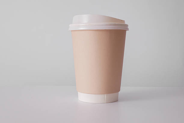 istock Eco friendly craft hot drink cup with lid on a white table 2246298408