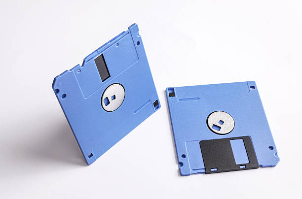 istock Two blue 3.5 inch floppy disks isolated on white background 2246299761