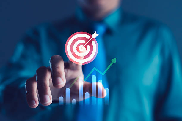 istock Businessman Touching Target Icon with Growth Graph Symbolizing Business Strategy, Sales Goal and Marketing Success 2246301551