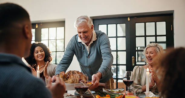 istock Serving, family dinner and man with chicken at table, applause and congratulations for thanksgiving feast. Clap, support and people with turkey in dining room, holiday reunion and food celebration 2246301603
